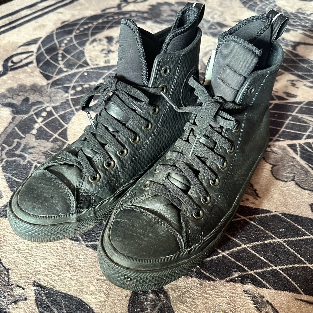 Converse black, waterproof high tops.